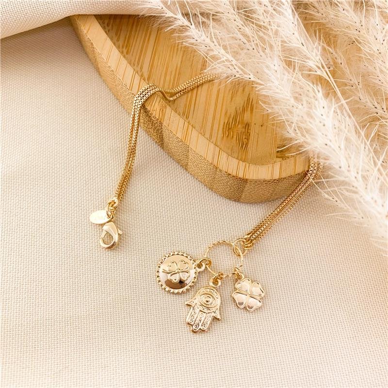 PULSEIRA COM PINGENTES AMULETO