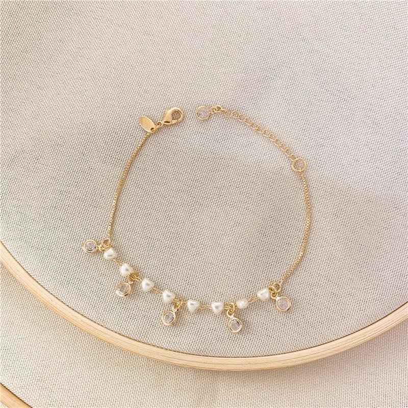 PULSEIRA VENEZIANA CORAÇÃO PÉROLA E PONTO DE LUZ - CRISTAL