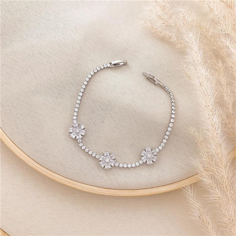 PULSEIRA RIVIERA FLOR-BANHO EM RÓDIO BRANCO - CRISTAL